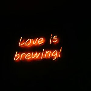 Glowing Neon Sign Love is Brewing