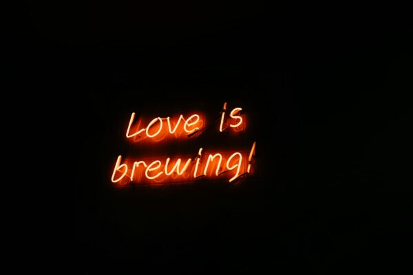 Glowing Neon Sign Love is Brewing