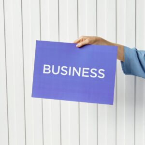 Person Holding Blue Placard